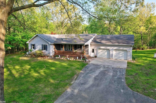 3641 Timber Ridge Dr, Metamora, MI 48455 - ranch-style house featuring a porch, a garage, concrete driveway, a front yard, and roof with shingles