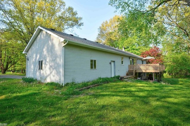 3641 Timber Ridge Dr, Metamora, MI 48455 - back of property featuring a deck and a yard