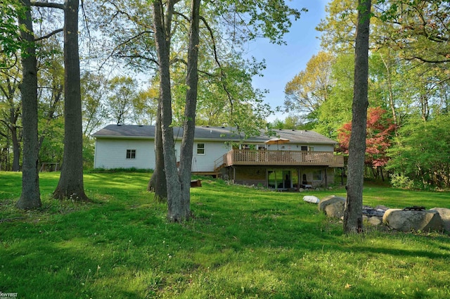3641 Timber Ridge Dr, Metamora, MI 48455 - rear view of property with a deck and a lawn