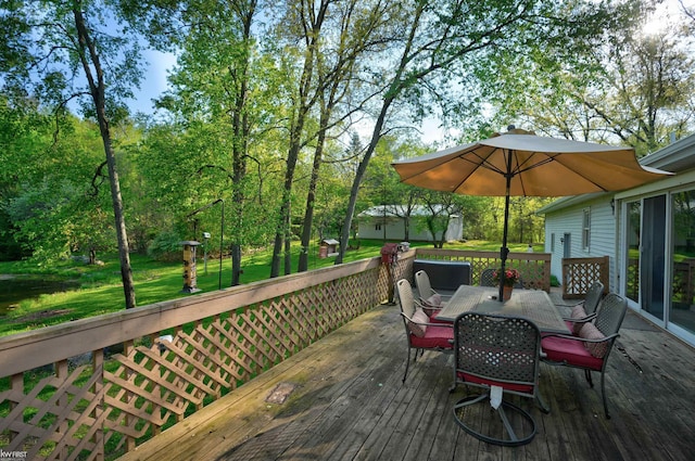 3641 Timber Ridge Dr, Metamora, MI 48455 - wooden deck featuring outdoor dining space and a yard