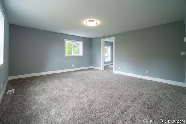 3188 E Stage Rd, Ionia, MI 48846 - spare room with baseboards and carpet flooring