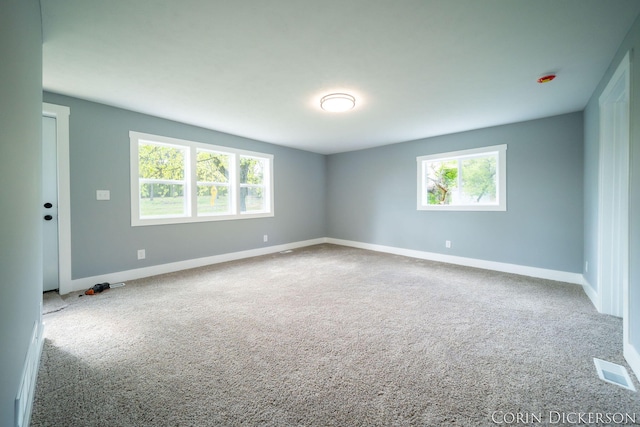 3188 E Stage Rd, Ionia, MI 48846 - spare room featuring carpet, plenty of natural light, and baseboards