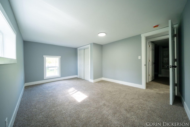 3188 E Stage Rd, Ionia, MI 48846 - unfurnished bedroom with carpet and baseboards