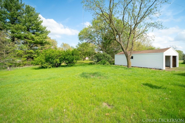 3188 E Stage Rd, Ionia, MI 48846 - view of grassy yard with an outdoor structure