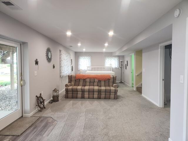 1788 W Beaver Rd, Bitely, MI 49309 - living area with recessed lighting, carpet, baseboards, and stairway