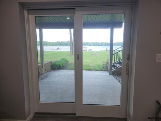 1788 W Beaver Rd, Bitely, MI 49309 - doorway to outside with a water view and plenty of natural light