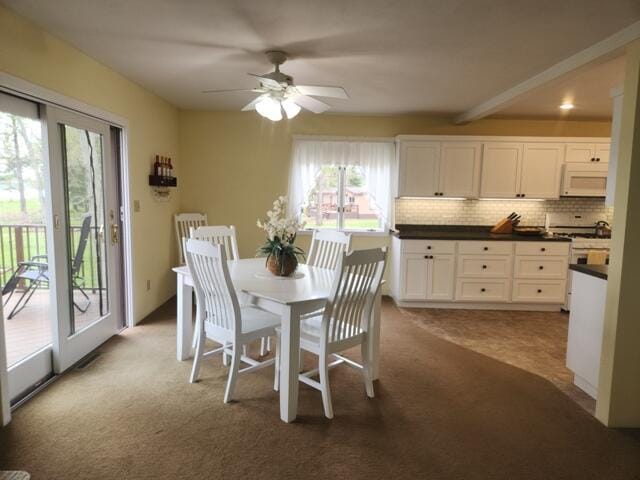 1788 W Beaver Rd, Bitely, MI 49309 - dining space featuring ceiling fan and carpet floors