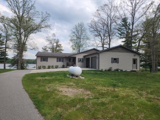 1788 W Beaver Rd, Bitely, MI 49309 - single story home with an attached garage and a front lawn