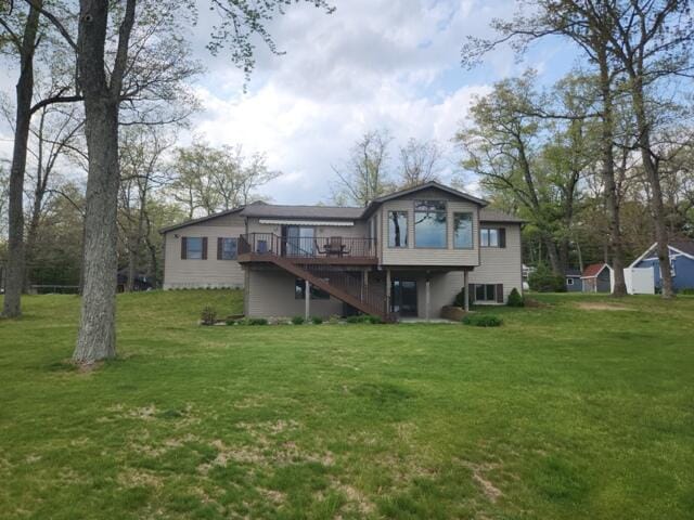 1788 W Beaver Rd, Bitely, MI 49309 - rear view of property featuring stairs, a wooden deck, a lawn, and cooling unit