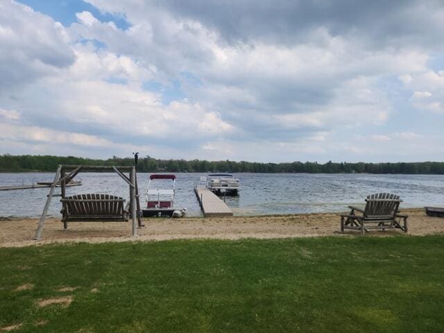 1788 W Beaver Rd, Bitely, MI 49309 - dock featuring a water view and a yard