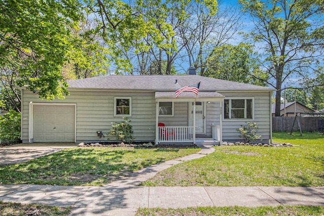 view of front facade with a porch, a garage, driveway, and a shingled roof