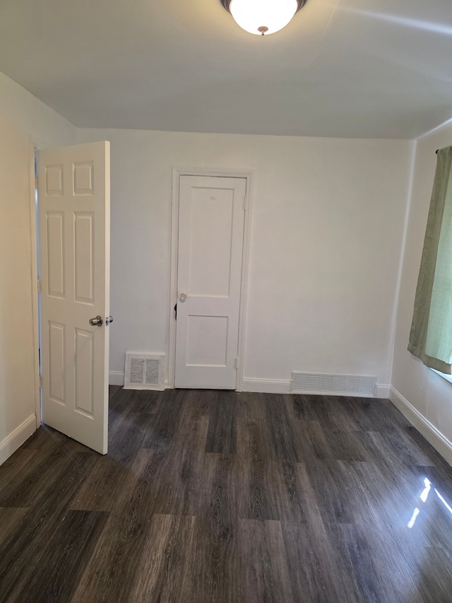 8845 Faust Ave, Detroit, MI 48228 - spare room with dark wood-style floors and baseboards
