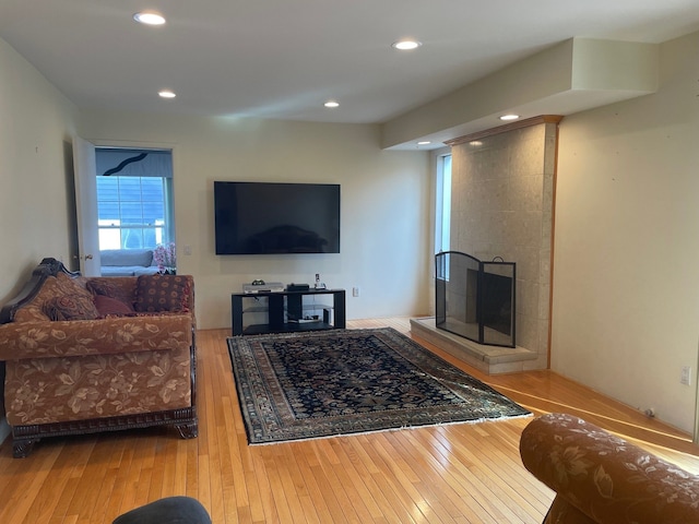 5250 Hardwoods Dr, West Bloomfield, MI 48323 - living room featuring hardwood / wood-style flooring, a tile fireplace, and recessed lighting