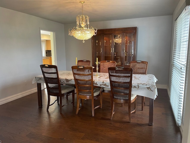 5250 Hardwoods Dr, West Bloomfield, MI 48323 - dining space featuring a chandelier, baseboards, and dark wood finished floors