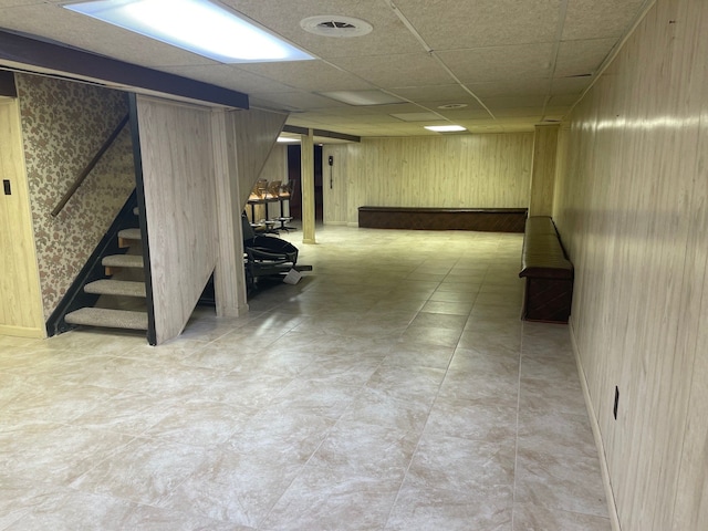 5250 Hardwoods Dr, West Bloomfield, MI 48323 - finished below grade area with stairway, wood walls, and a drop ceiling