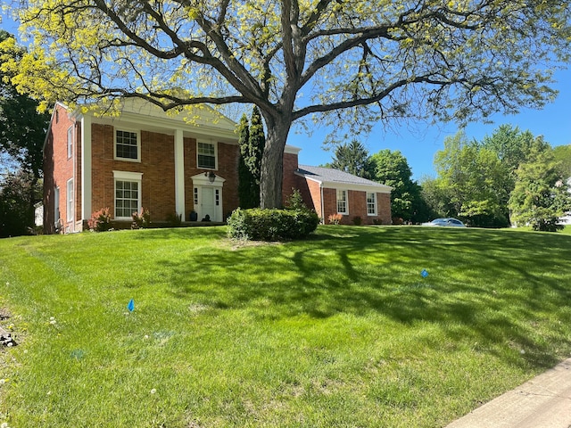 5250 Hardwoods Dr, West Bloomfield, MI 48323 - greek revival house featuring brick siding and a front yard