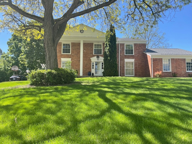 5250 Hardwoods Dr, West Bloomfield, MI 48323 - greek revival house featuring brick siding and a front lawn