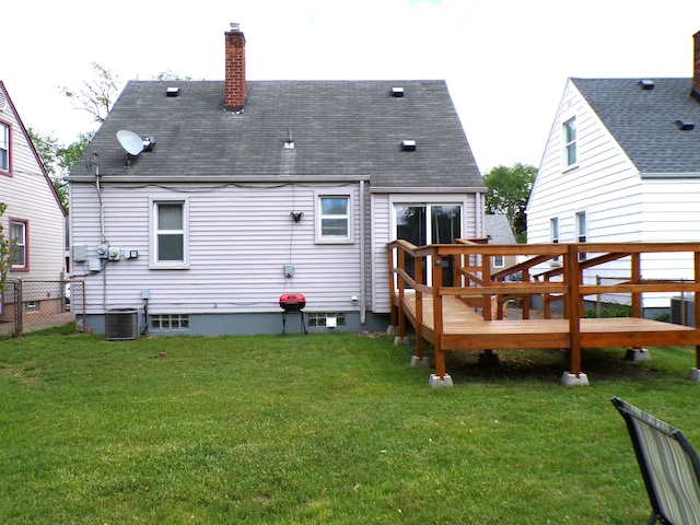 4140 Academy St, Dearborn Heights, MI 48125 - back of house featuring a chimney, a wooden deck, a shingled roof, and central air condition unit