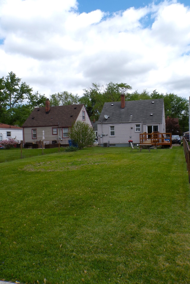 4140 Academy St, Dearborn Heights, MI 48125 - view of grassy yard with a wooden deck