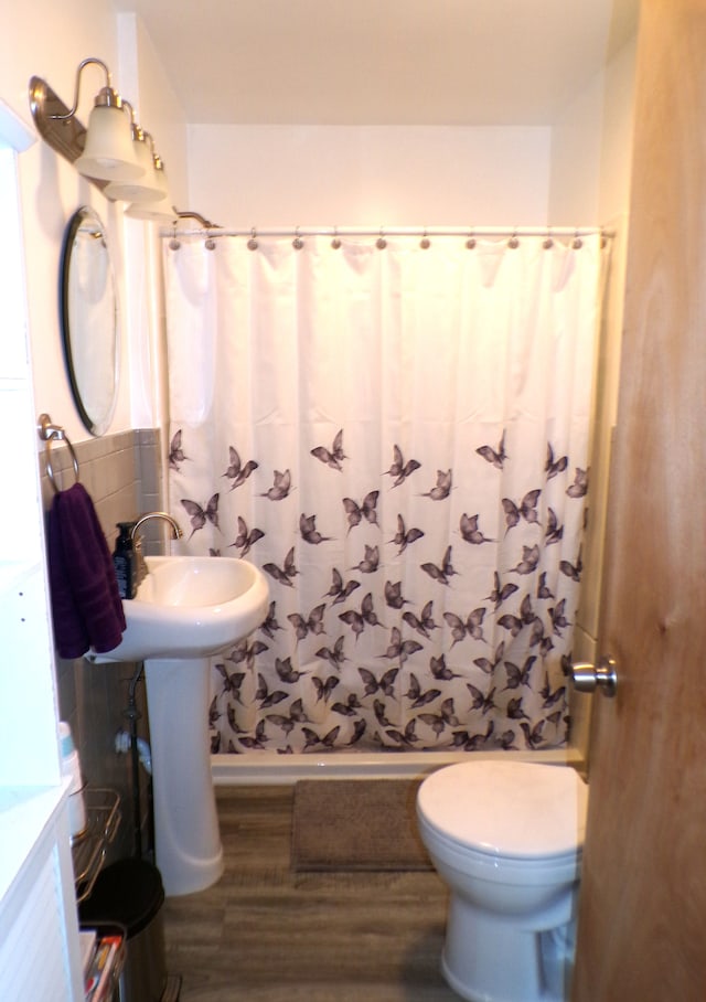 4140 Academy St, Dearborn Heights, MI 48125 - full bath with wood finished floors, a shower with curtain, and toilet