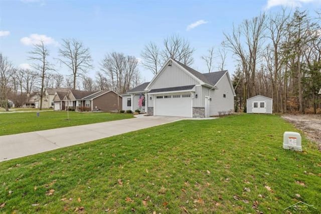 12405 Northway Pkwy, Freeland, MI 48623 - view of front of house with an attached garage, driveway, a front lawn, stone siding, and board and batten siding