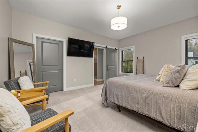 12405 Northway Pkwy, Freeland, MI 48623 - bedroom featuring light carpet and baseboards