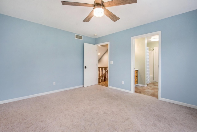 7512 Trophy Ct, Grass Lake, MI 49240 - unfurnished bedroom featuring light carpet, baseboards, and a ceiling fan