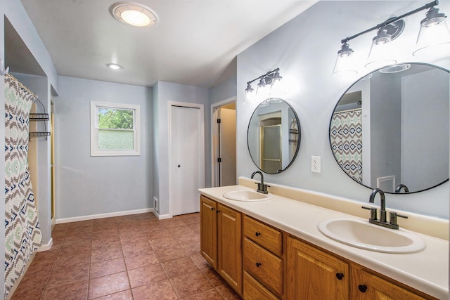 7512 Trophy Ct, Grass Lake, MI 49240 - bathroom featuring baseboards, double vanity, and curtained shower
