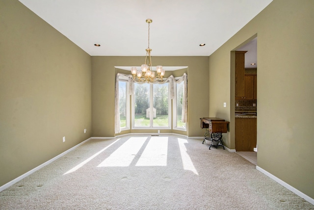 9968 Tuscany Valley Way S, Lyon, MI 48178 - unfurnished dining area featuring light carpet, a chandelier, and baseboards