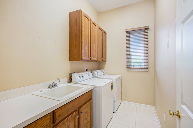 9968 Tuscany Valley Way S, Lyon, MI 48178 - laundry room featuring washer and dryer, cabinet space, baseboards, and light tile patterned floors
