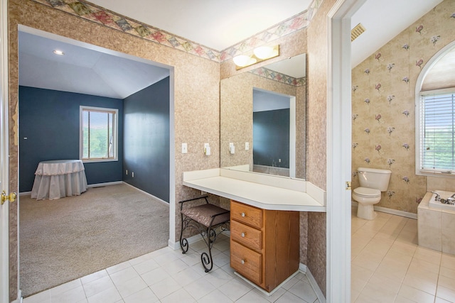 9968 Tuscany Valley Way S, Lyon, MI 48178 - full bathroom with plenty of natural light, toilet, tile patterned flooring, and vaulted ceiling