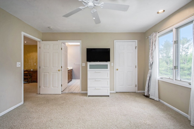 9968 Tuscany Valley Way S, Lyon, MI 48178 - unfurnished bedroom featuring multiple windows, light colored carpet, baseboards, and recessed lighting