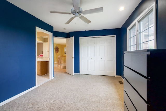 9968 Tuscany Valley Way S, Lyon, MI 48178 - unfurnished bedroom featuring carpet floors, baseboards, a closet, and a ceiling fan
