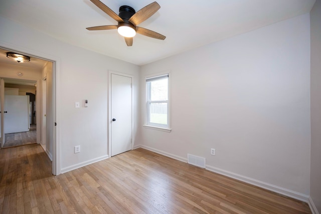 5875 S Madison St, Taylor, MI 48180 - unfurnished bedroom featuring wood finished floors, baseboards, and a ceiling fan