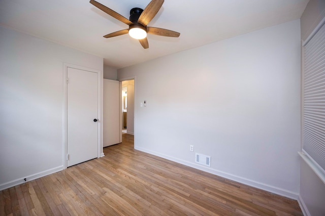 5875 S Madison St, Taylor, MI 48180 - unfurnished bedroom featuring baseboards, light wood finished floors, and ceiling fan