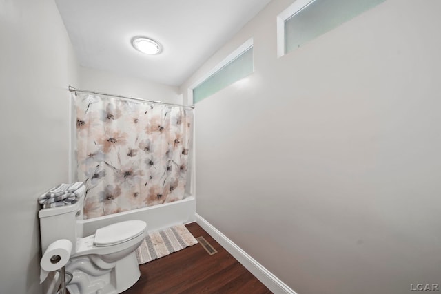 3224 Thornhill Dr, Adrian, MI 49221 - full bath featuring wood finished floors, toilet, shower / bath combination with curtain, and baseboards
