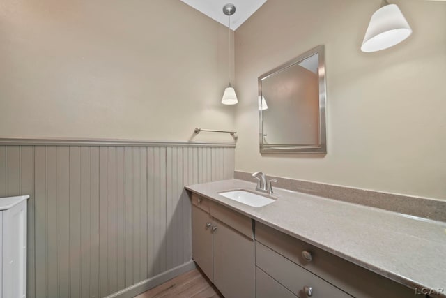 3224 Thornhill Dr, Adrian, MI 49221 - bathroom with vanity, wainscoting, and wood finished floors