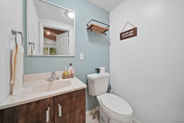 3224 Thornhill Dr, Adrian, MI 49221 - bathroom with toilet, vanity, and baseboards