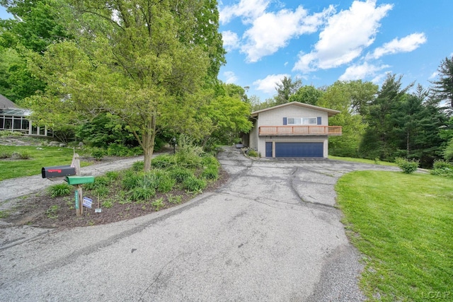 3224 Thornhill Dr, Adrian, MI 49221 - view of front of property featuring an attached garage, asphalt driveway, and a front yard