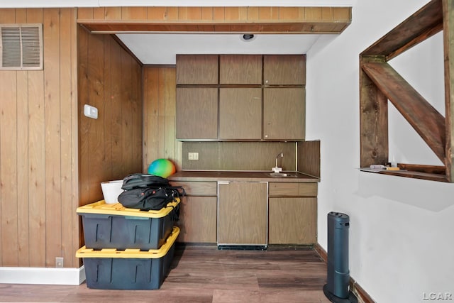 3224 Thornhill Dr, Adrian, MI 49221 - bar area with wooden walls, a sink, dark wood finished floors, and baseboards