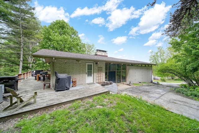 3224 Thornhill Dr, Adrian, MI 49221 - back of property featuring brick siding, a deck, and a chimney