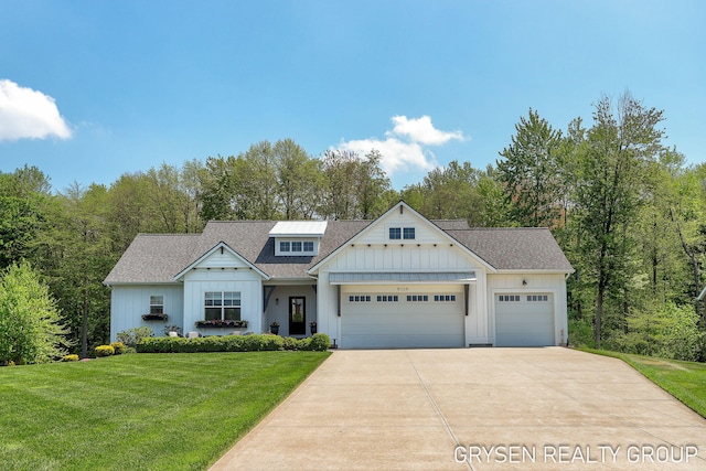 6326 Eaglewood Dr, Hudsonville, MI 49426 - modern farmhouse style home with board and batten siding, a garage, concrete driveway, a front lawn, and roof with shingles