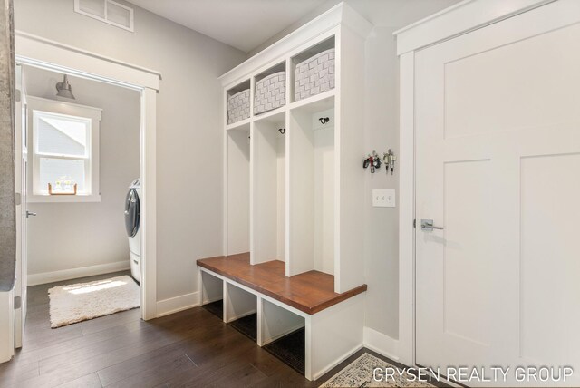 6326 Eaglewood Dr, Hudsonville, MI 49426 - mudroom with dark wood-style floors, baseboards, and washer / clothes dryer