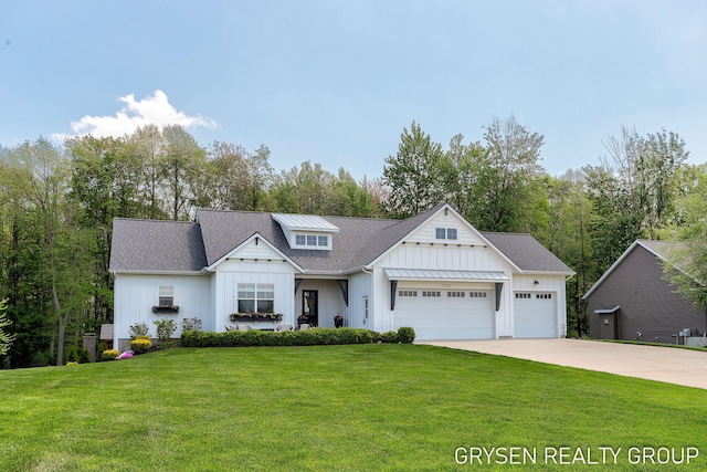 6326 Eaglewood Dr, Hudsonville, MI 49426 - modern farmhouse featuring board and batten siding, a garage, driveway, and a front lawn