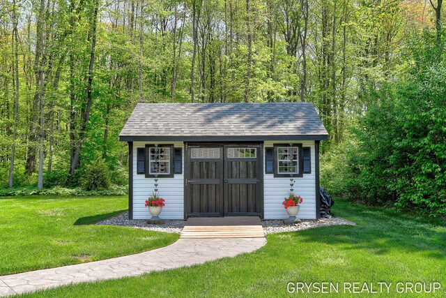 6326 Eaglewood Dr, Hudsonville, MI 49426 - view of shed with a wooded view