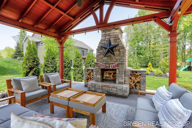 6326 Eaglewood Dr, Hudsonville, MI 49426 - view of patio / terrace featuring an outdoor living space with a fireplace, a gazebo, and a playground