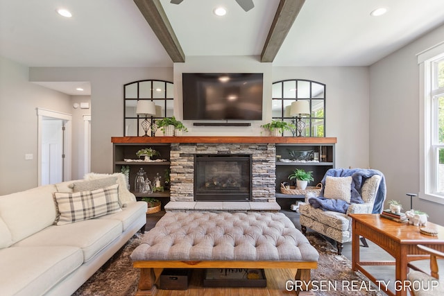 6326 Eaglewood Dr, Hudsonville, MI 49426 - living area featuring wood finished floors, beam ceiling, recessed lighting, ceiling fan, and a fireplace