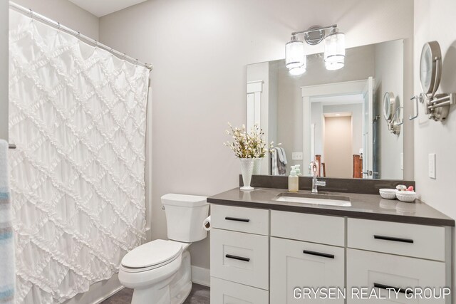 6326 Eaglewood Dr, Hudsonville, MI 49426 - bathroom with toilet, vanity, and a shower with shower curtain