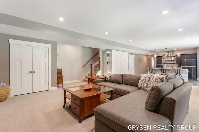 6326 Eaglewood Dr, Hudsonville, MI 49426 - living area featuring recessed lighting, stairway, light colored carpet, and baseboards