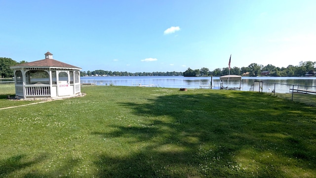 25722 Rainbow Dr, Sturgis, MI 49091 - view of green lawn featuring a gazebo, a water view, and a boat dock